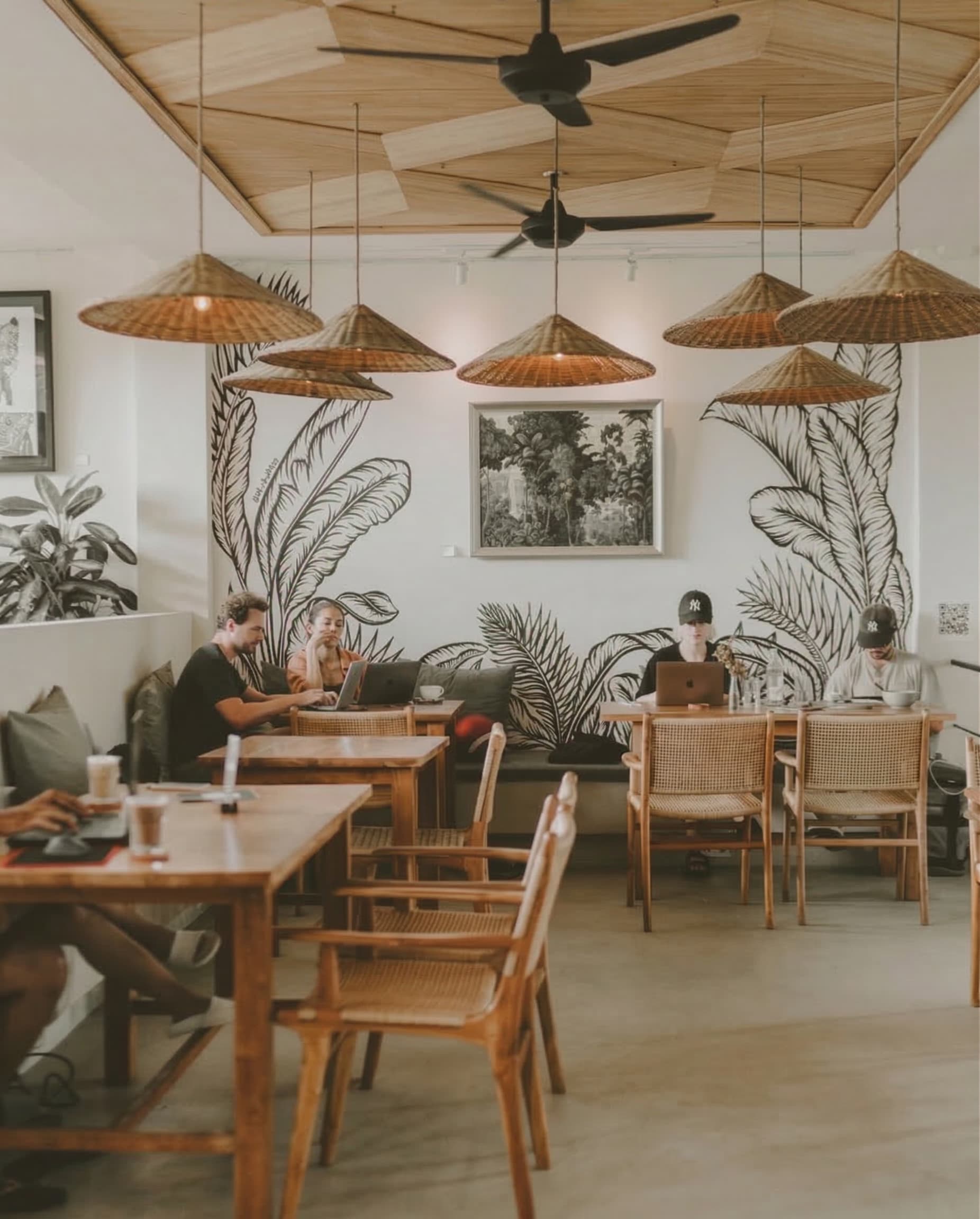 Interns working from a café in Bali