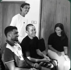 Interns laughing together in the villa common room