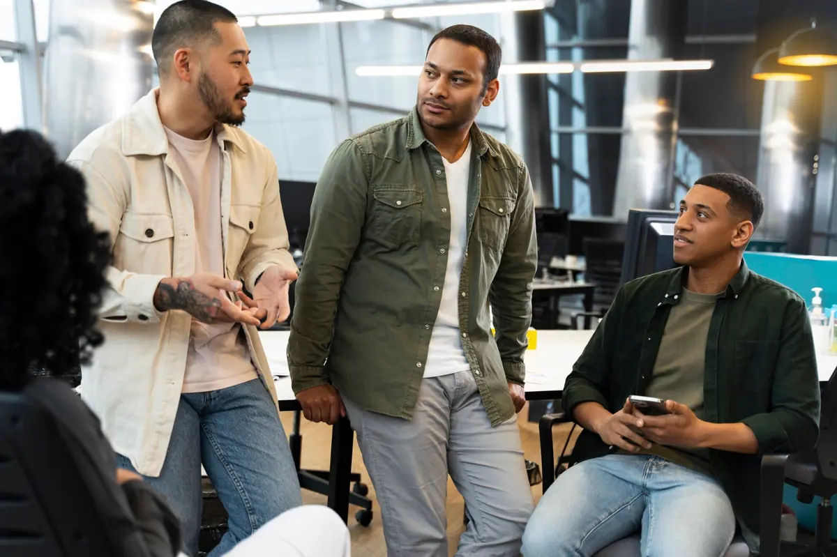 A startup team discussing work in a modern office