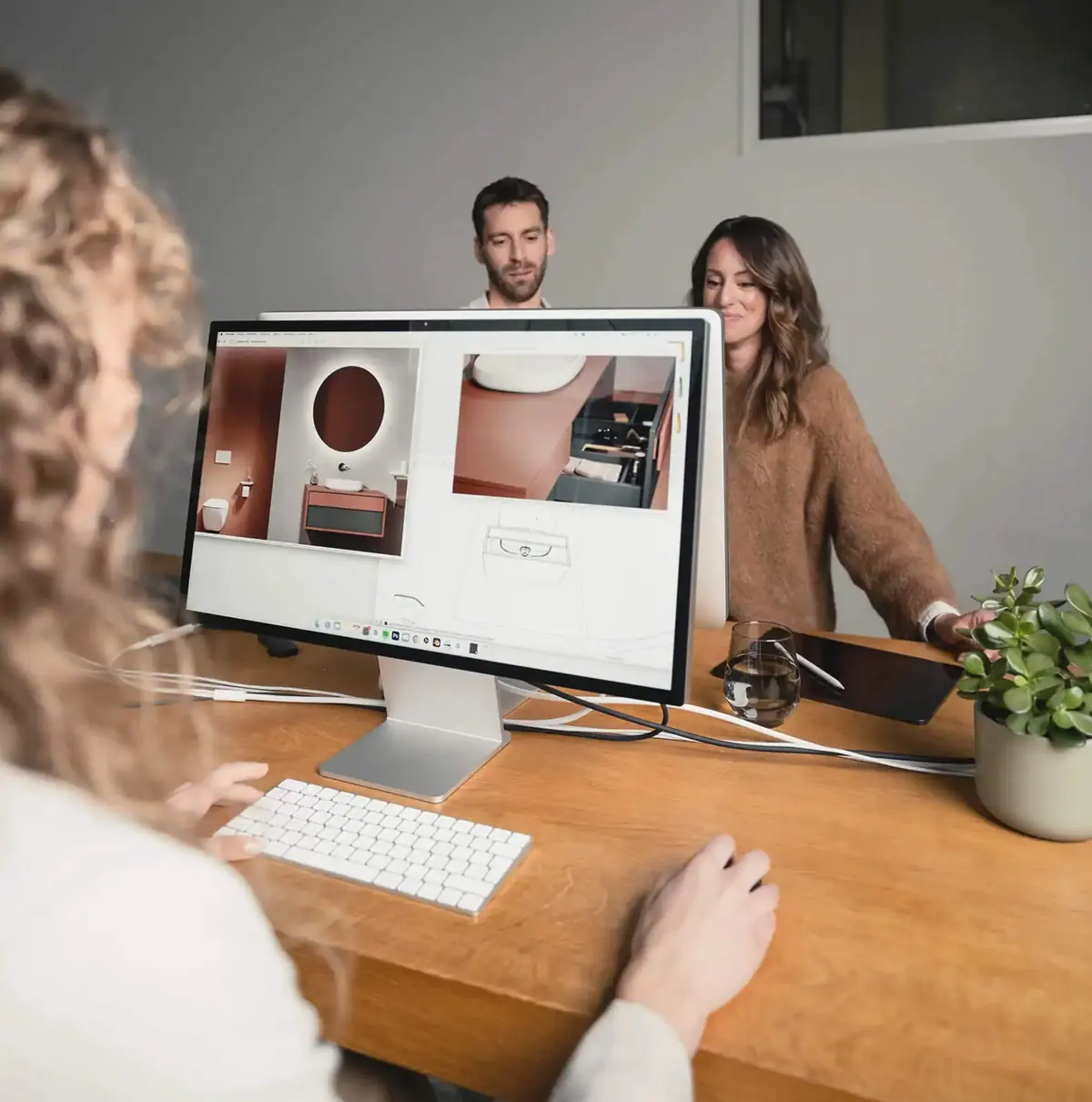 A design team reviewing product visualisations on a monitor