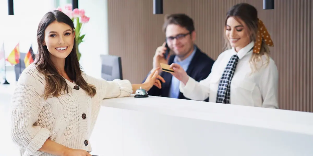 Guest checking in at a hotel reception desk