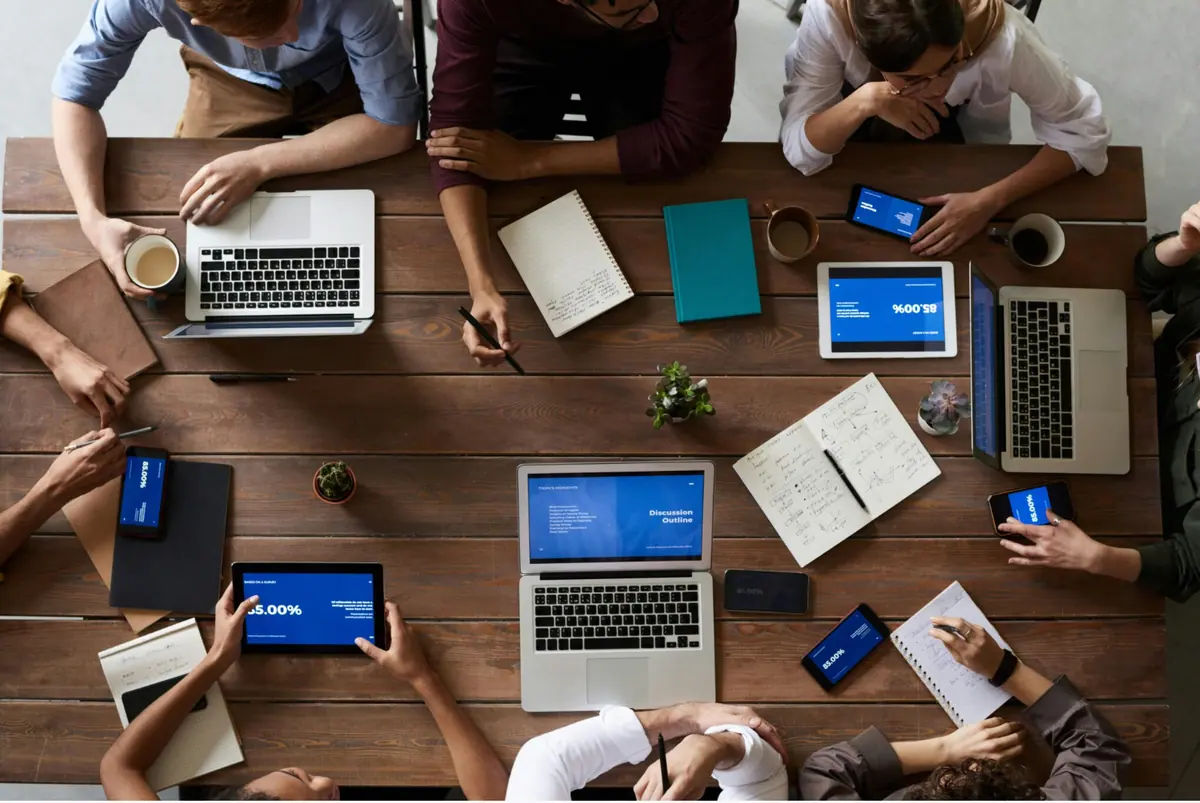 Operations team working around a shared table