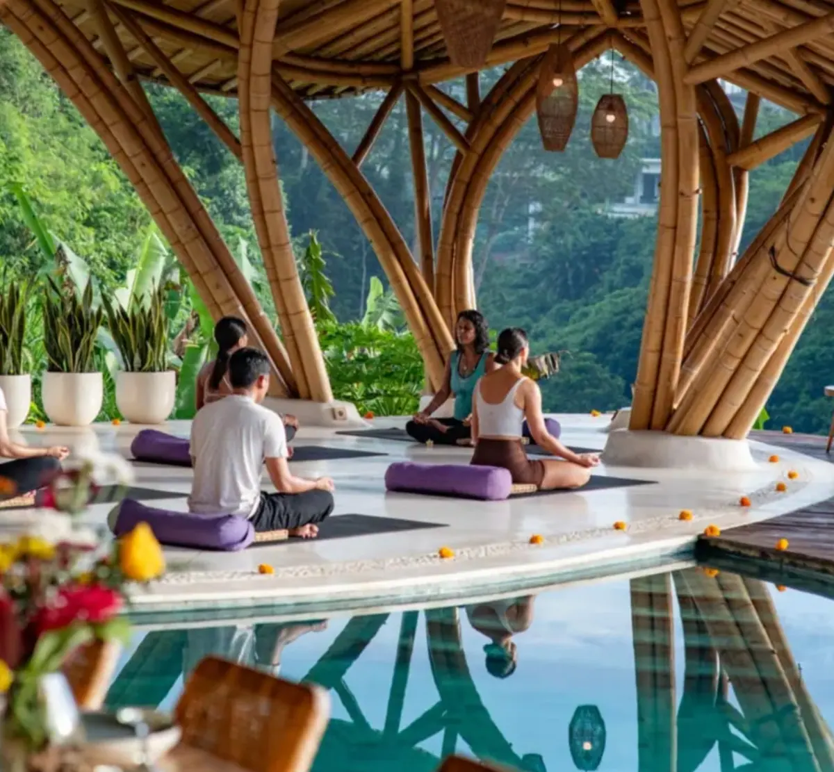Wellness retreat guests in a bamboo pavilion in Bali