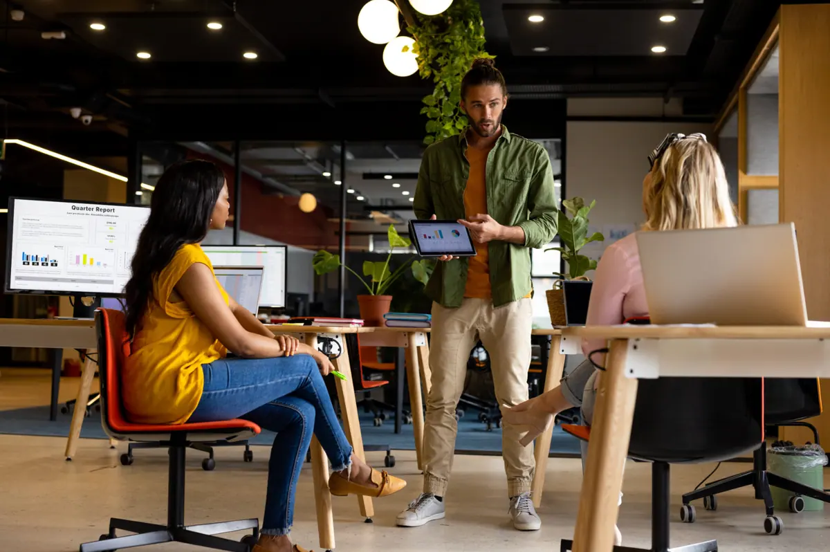 Email and CRM marketing interns reviewing campaign results in a Bali office