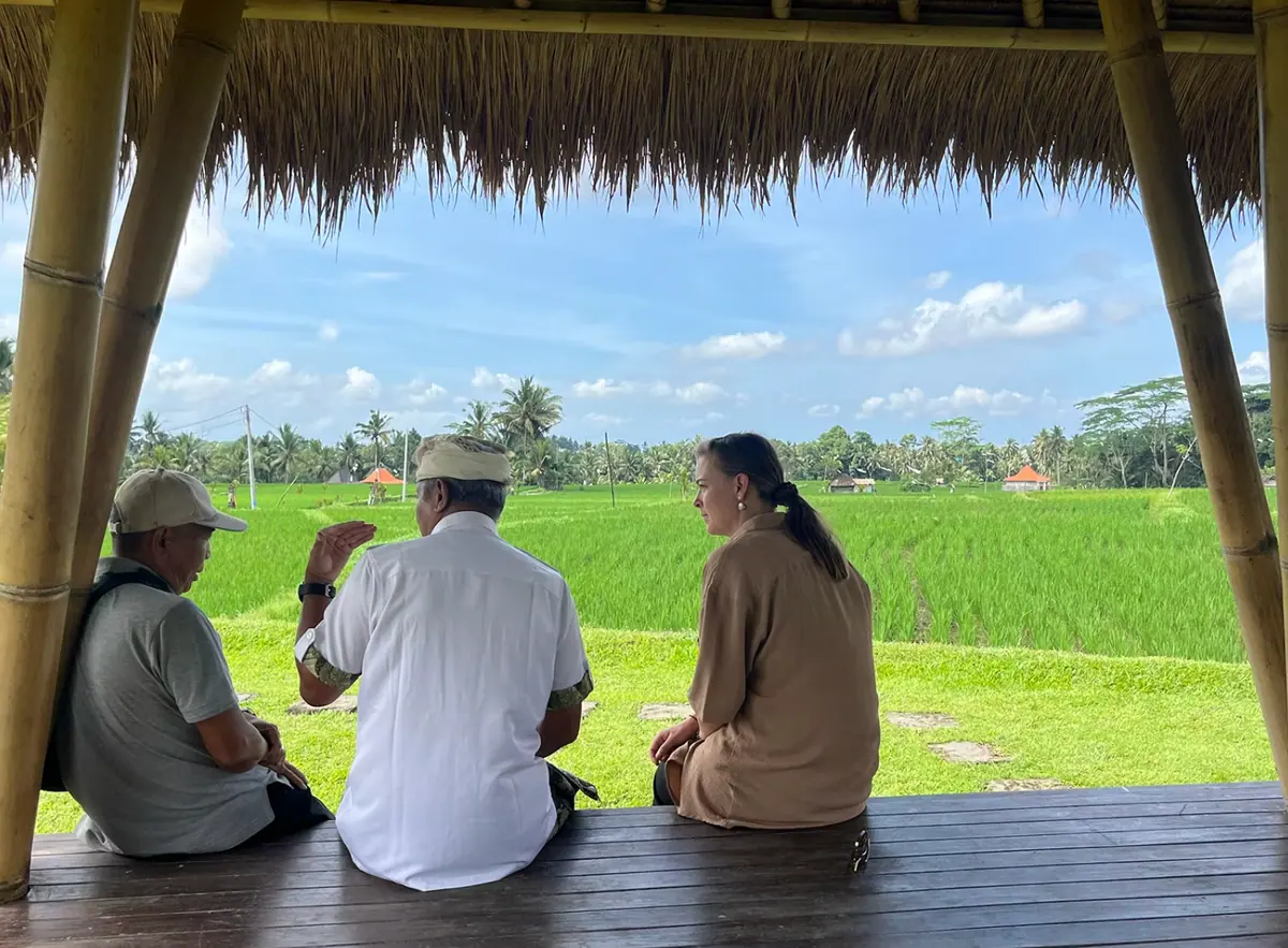 Conversation with local community members in Bali rice fields