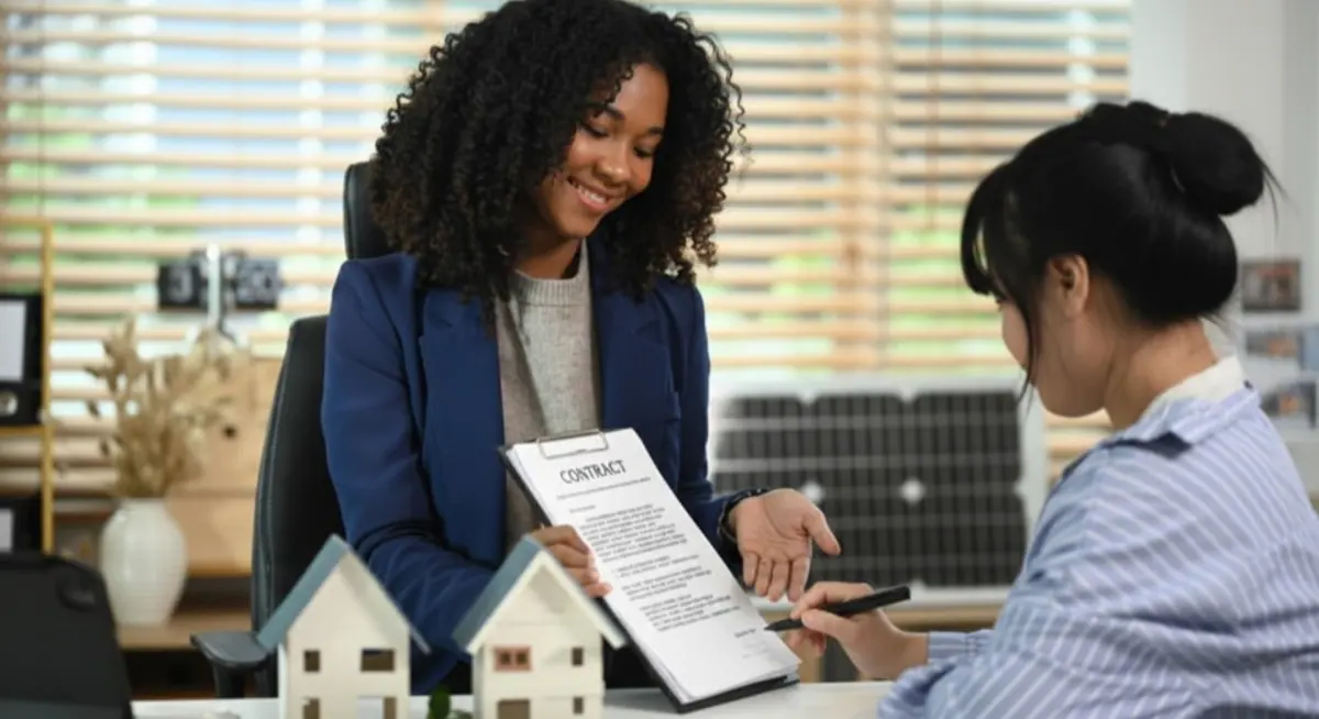 Professional discussing a funding agreement with a client
