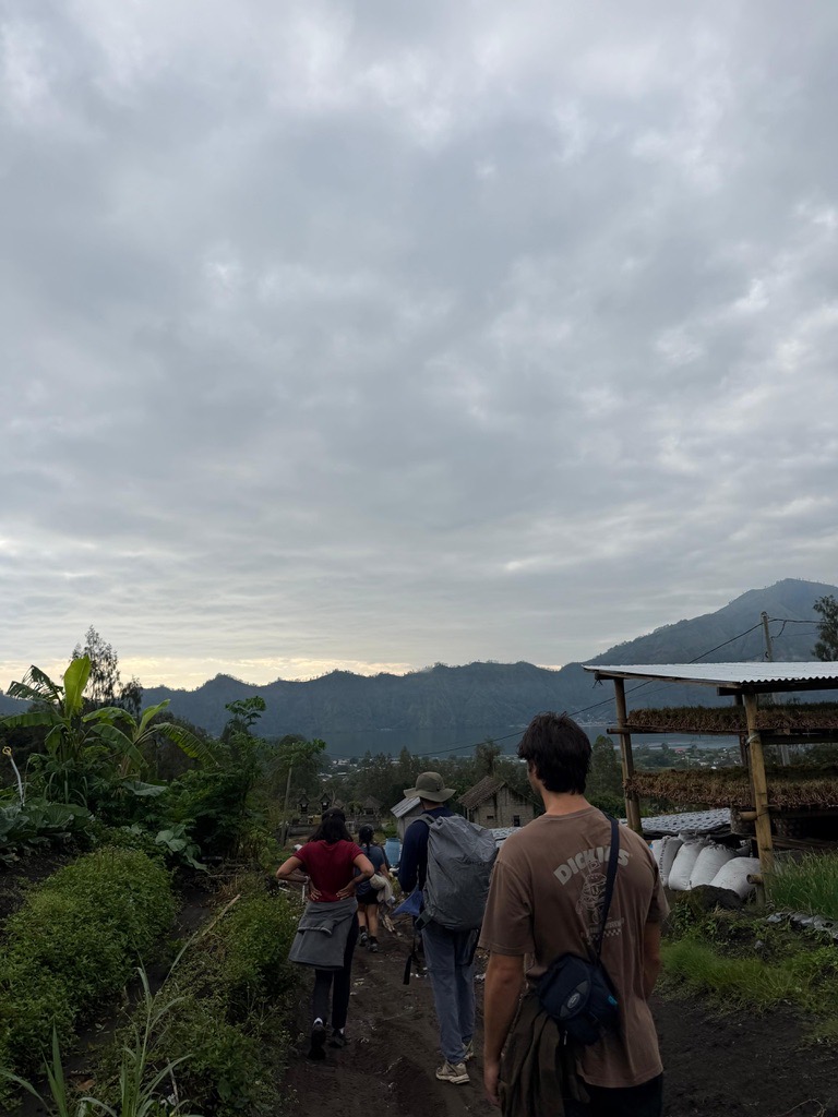 Students walking through a highland village on a weekend trip in Bali