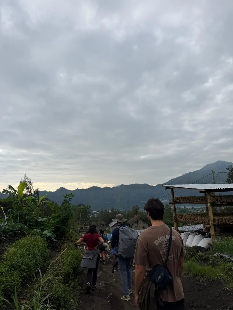 Students walking through a highland village on a weekend trip in Bali